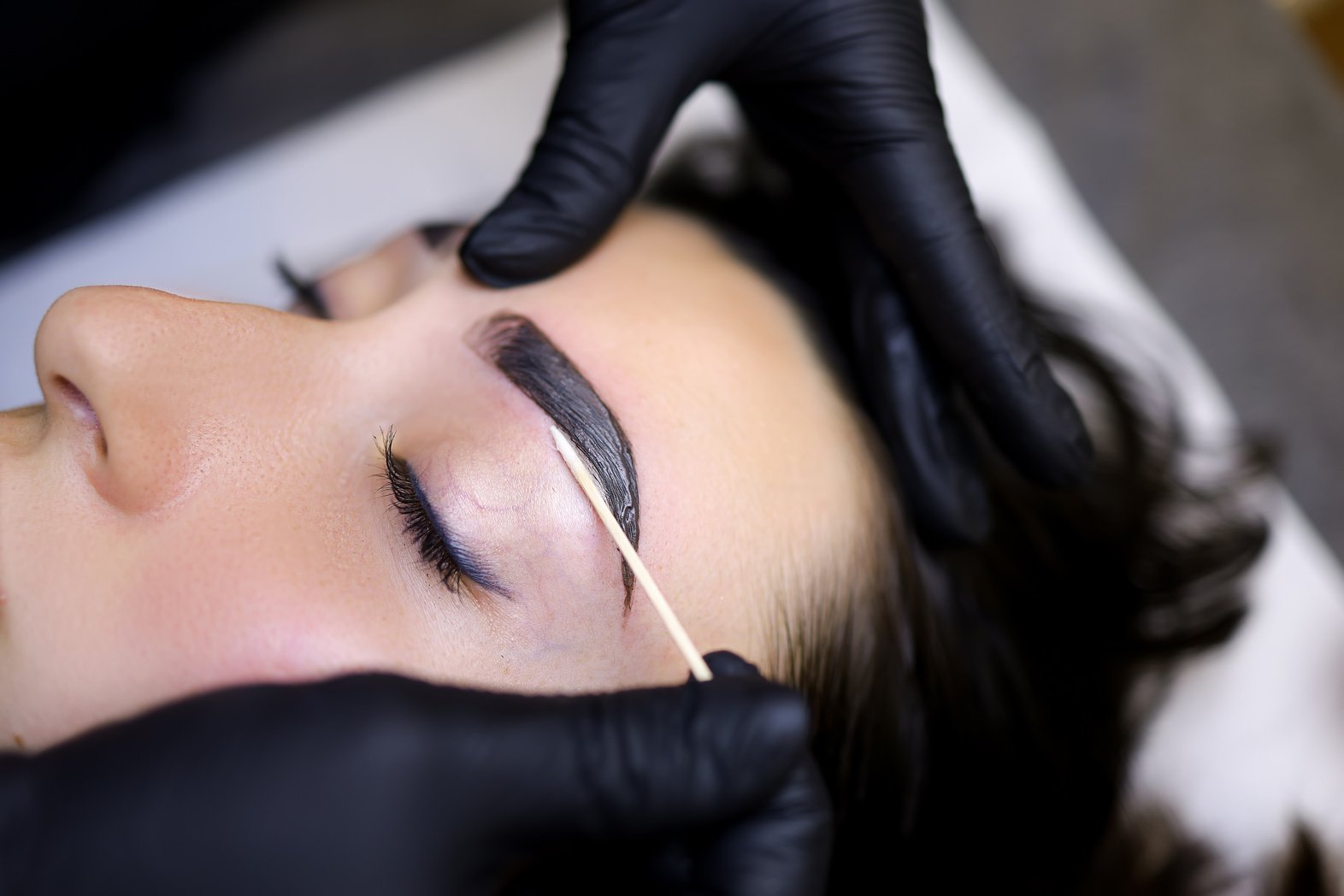 A Close-up of the Procedure of Coloring the Eyebrows with Paint